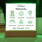 LED sign with green illustrations and text on a wooden stand, glowing green.