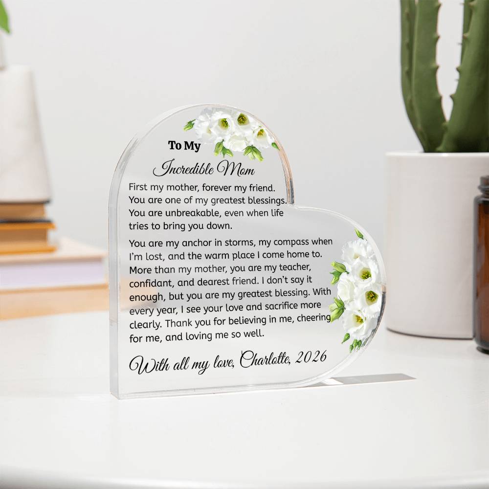 Personalized glass plaque with a heartfelt message to an incredible mom, featuring floral designs on a white surface.