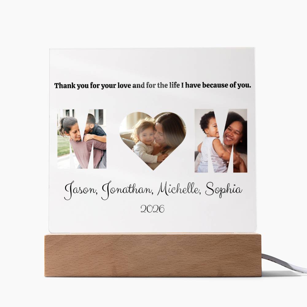 Personalized photo lamp with wooden base displaying family photos and text.