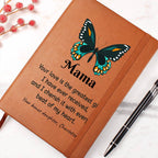 Brown notebook with butterfly design and engraved text on a white background