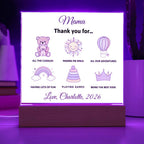 LED sign with purple graphics and text on a white background, placed on a wooden stand with a purple light.