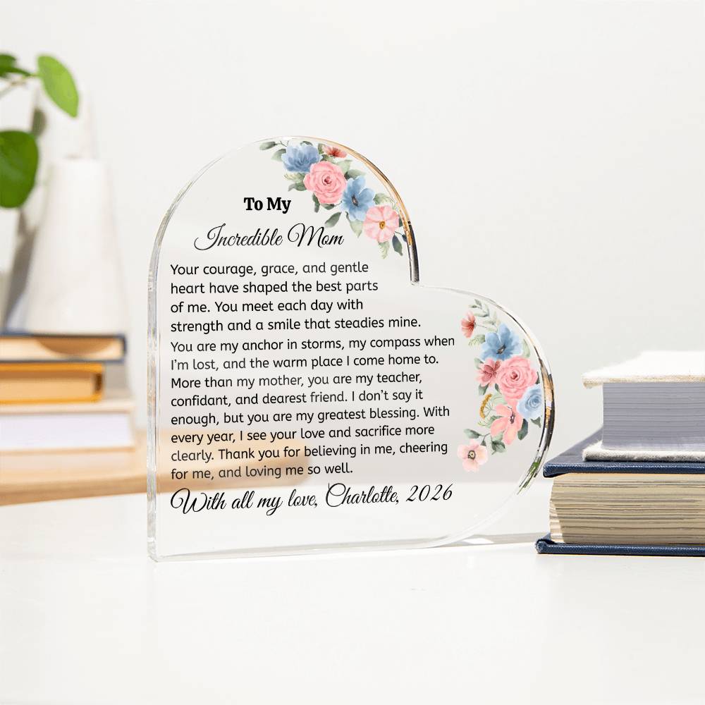 Heart-shaped glass plaque with floral design and engraved text for an incredible mom on a white background.