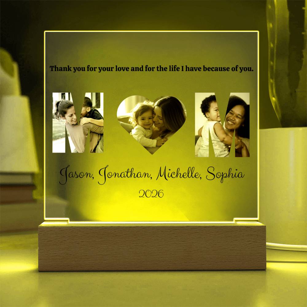 Personalized photo frame with family images and text on a wooden base.