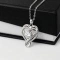 Heart-shaped White Gold Finish over Brass necklace with a cubic zirconia stone, with a black and white gift box