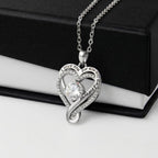 Heart-shaped White Gold Finish over Brass necklace with a cubic zirconia stone, with a black and white gift box