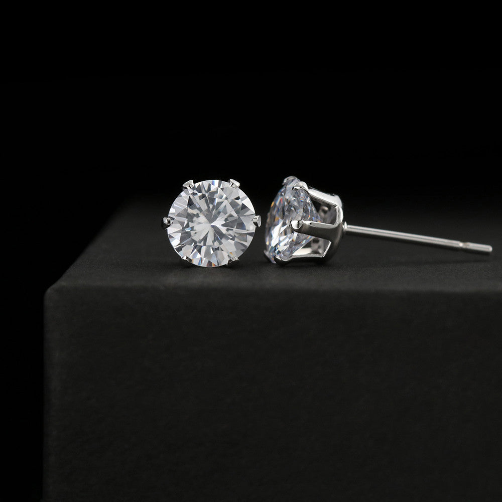 Close-up view of 6mm sparkling cubic zirconia stud earring showing 18k white gold finish setting