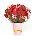Pop-up paper flower bouquet collapsed flat inside a protective gift envelope